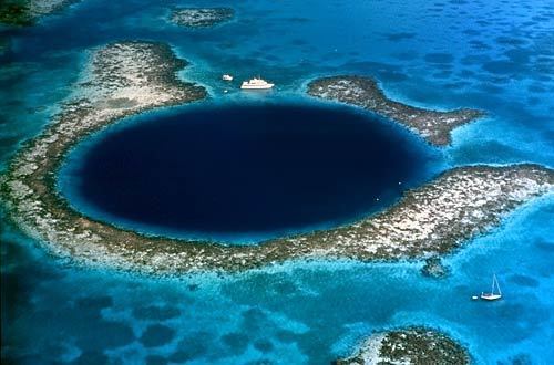 The Blue Hole sits on the Lighthouse Reef Atoll, about 50 miles east of Belize City.