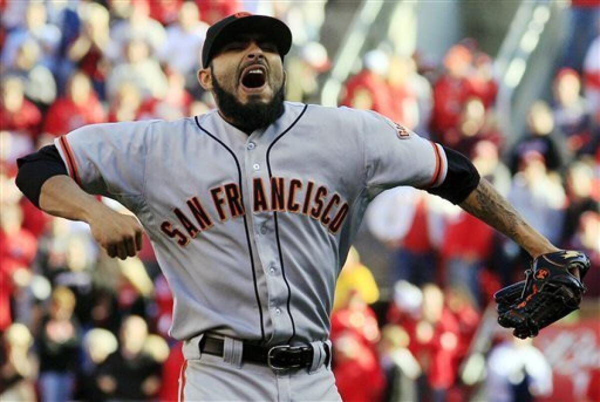 San Francisco Giants' Sergio Romo celebrates after the final out