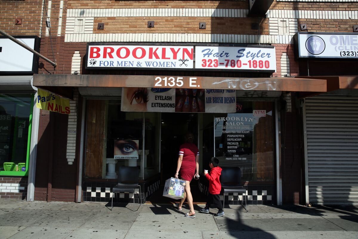 Customers arrive at Brooklyn Hair Styler in Boyle Heights.