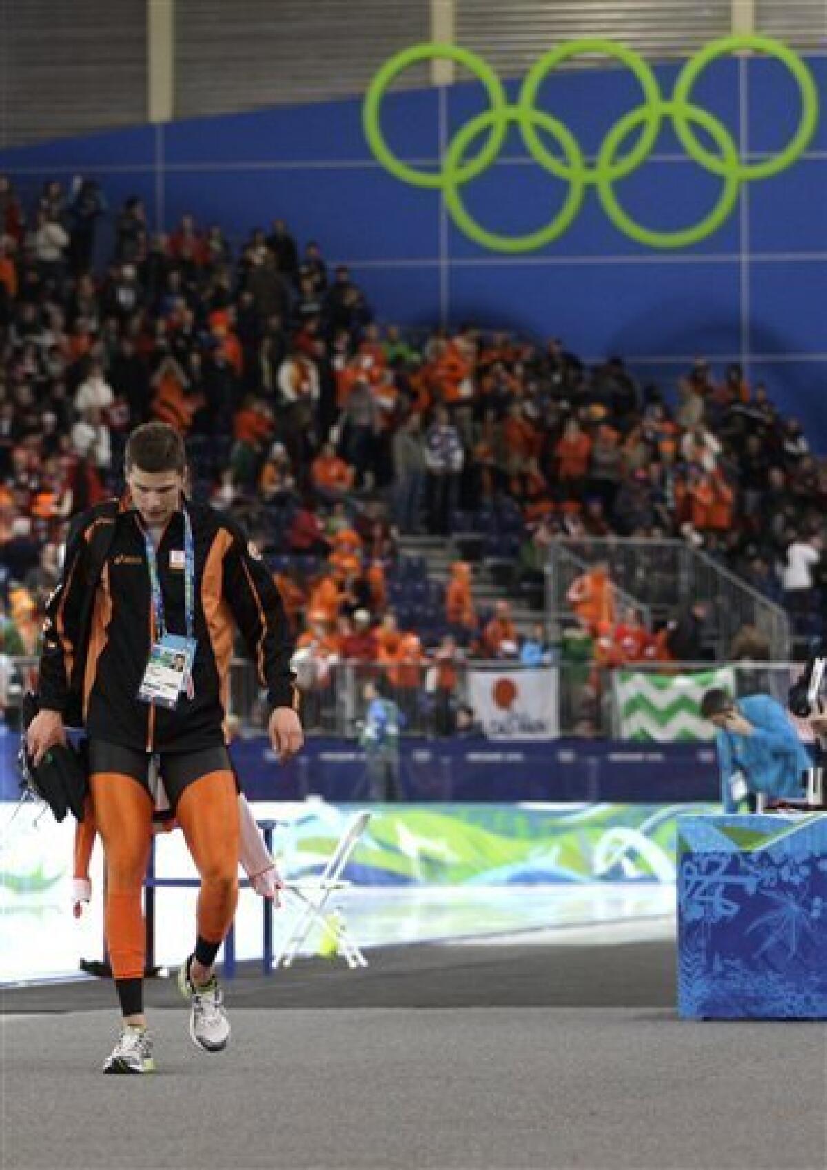 Netherlands's Sven Kramer, walks away after he was disqualified during the men's 10,000 meter speed skating race at the Richmond Olympic Oval at the Vancouver 2010 Olympics in Vancouver, British Columbia, Tuesday, Feb. 23, 2010. Lee Seung-hoon of South Korea won a stunning gold medal in men's 10,000-meter speedskating Tuesday when overwhelming favorite Sven Kramer made an amateurish mistake, failing to switch lanes just past the midway point of the race, and was disqualified. (AP Photo/Matt Dunham)