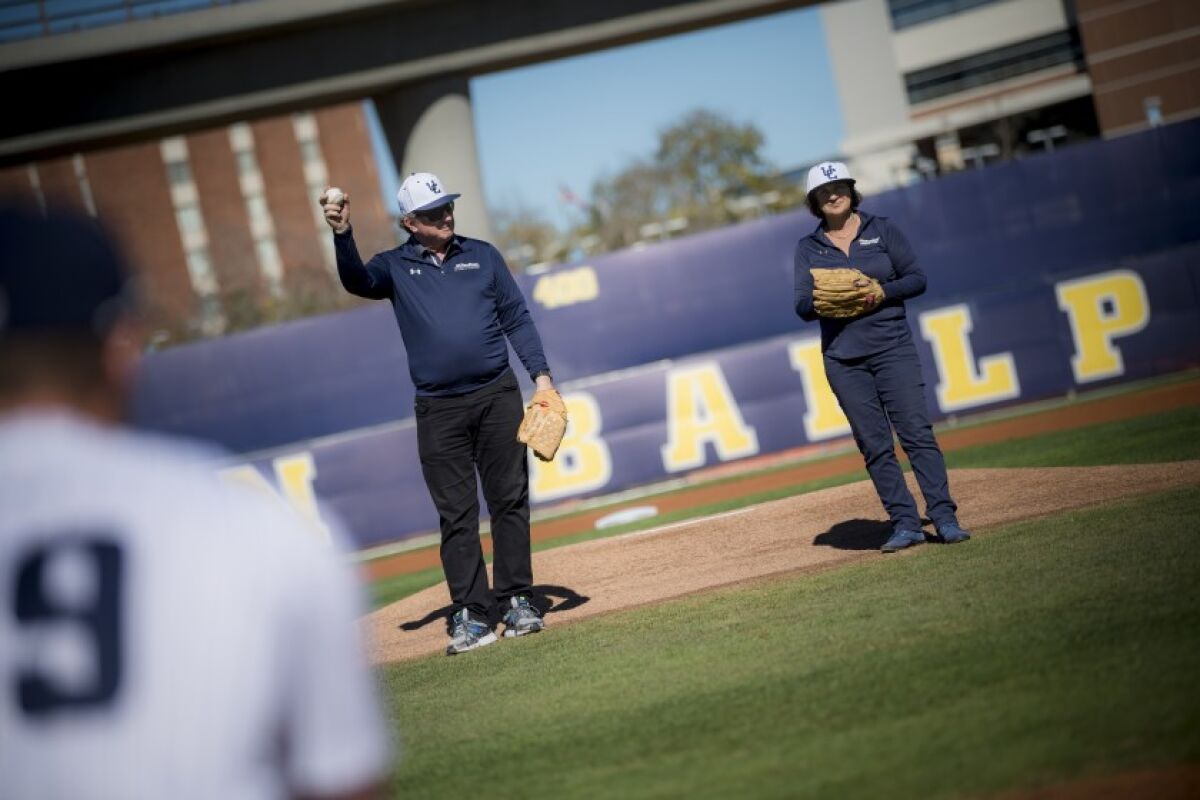 UC San Diego alumnus Gary Jacobs with his wife, Jerri-Ann, threw out the first pitch at the Triton baseball season opener Feb. 1. The local philanthropists have been longtime supporters of baseball at the university.