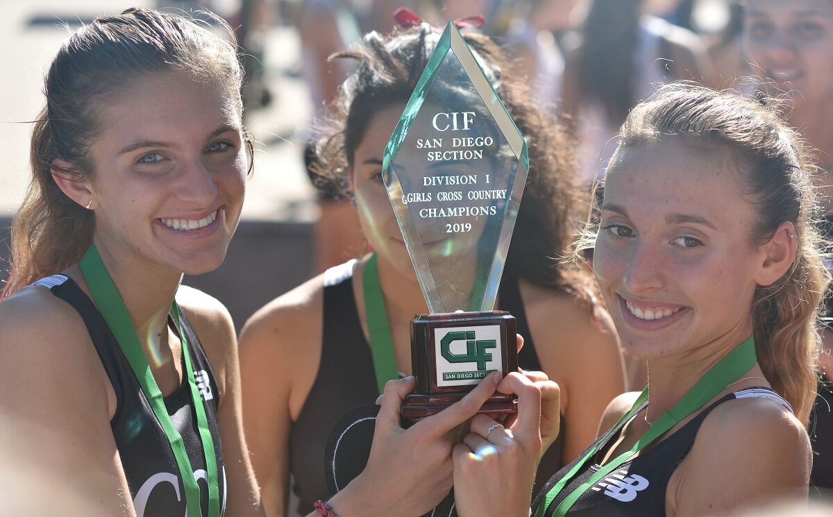 Carlie Dorostkar (l), Elizabeth Emberger (r) and Allison Rios (center) were CCA's top individual finishers Saturday.