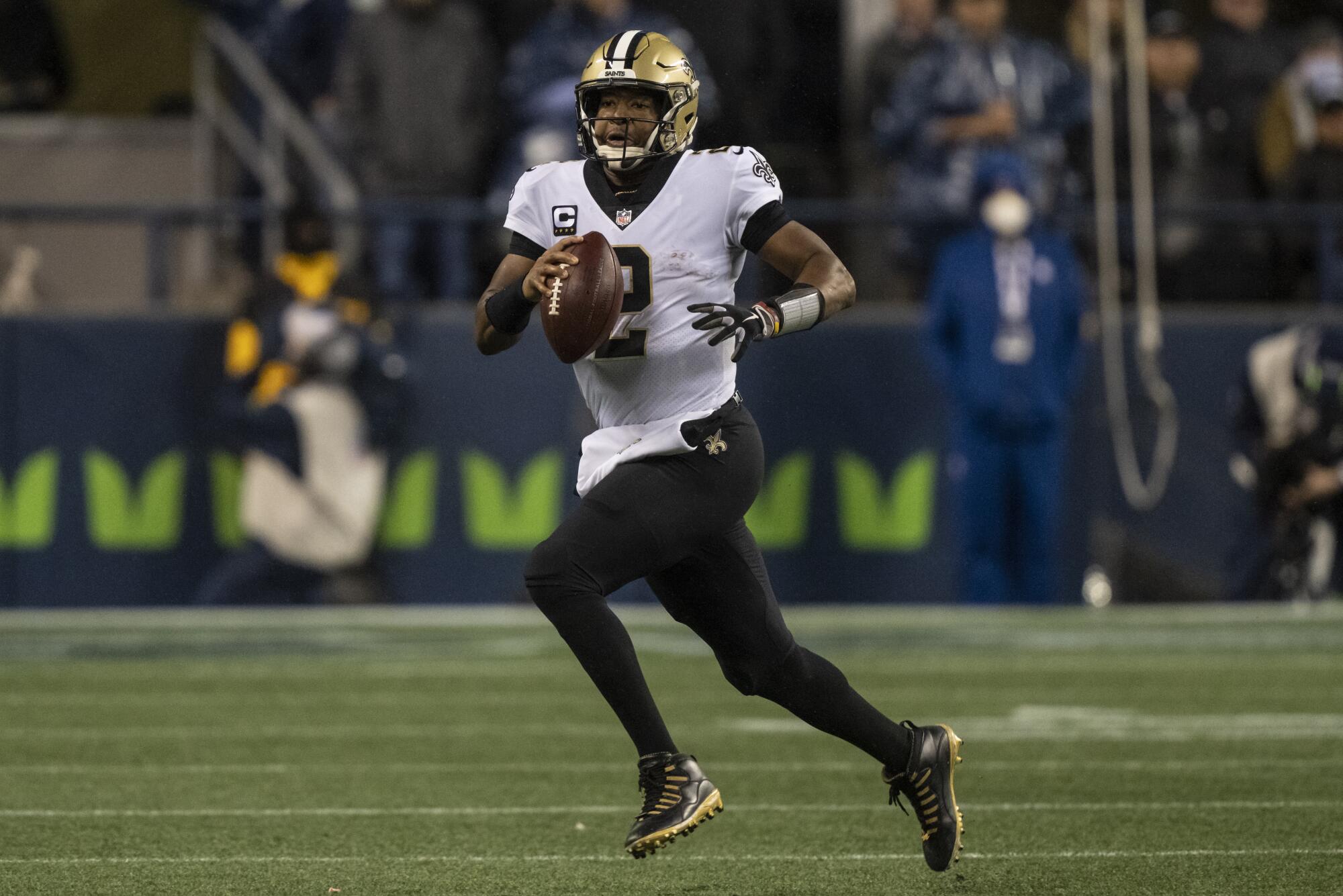 New Orleans Saints quarterback Jameis Winston runs with the ball against the Seattle Seahawks.