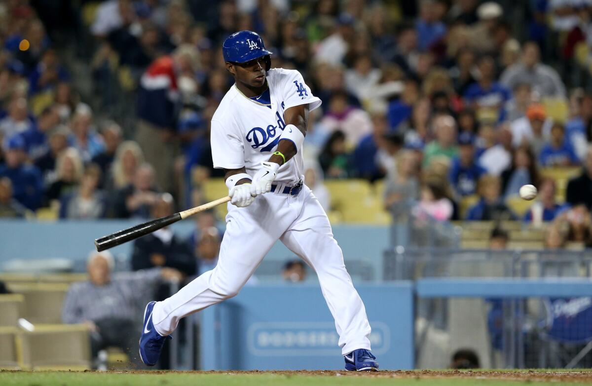 Dodgers' Yasiel Puig hits a solo home run in the sixth inning against the Atlanta Braves on Friday.
