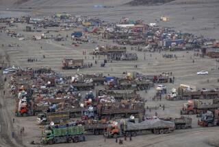 FILE- Afghan refugees settle in a camp near the Torkham Pakistan-Afghanistan border, in Torkham, Afghanistan, Friday, Nov. 3, 2023. Pakistan’s top court in the capital, Islamabad began hearing Friday, Dec. 1, a petition seeking to halt the deportation of Afghan refugees, officials said, a day after a province in the country's southwest set targets for police to arrest and deport hundreds of thousands of Afghans it says are in the country illegally.(AP Photo/Ebrahim Noroozi, File)