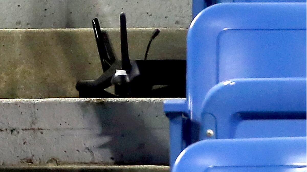 A drone sits on the steps in the stands of Louis Armstrong Stadium after crashing during a U.S. Open match between Flavia Pennetta and Monica Niculescu on Sept. 3.