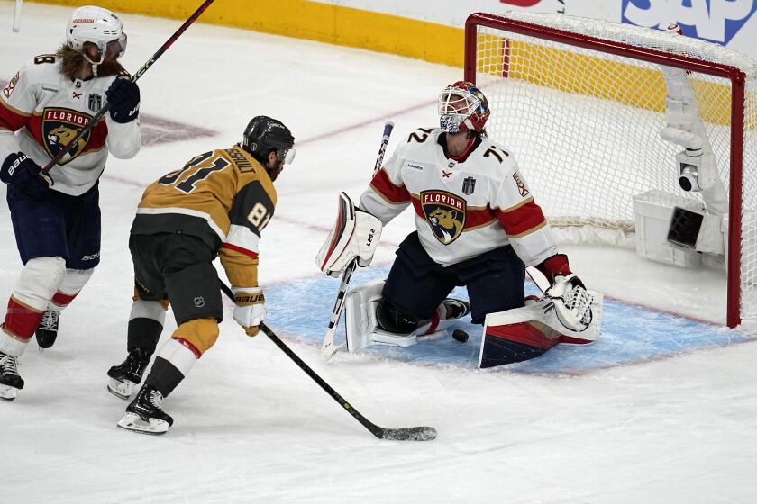 Vegas Golden Knights right wing Jonathan Marchessault (81) watches as a goal by defenseman Zach Whitecloud slips past Florida Panthers goaltender Sergei Bobrovsky (72) during the third period of Game 1 of the NHL hockey Stanley Cup Finals, Saturday, June 3, 2023, in Las Vegas. (AP Photo/Abbie Parr)
