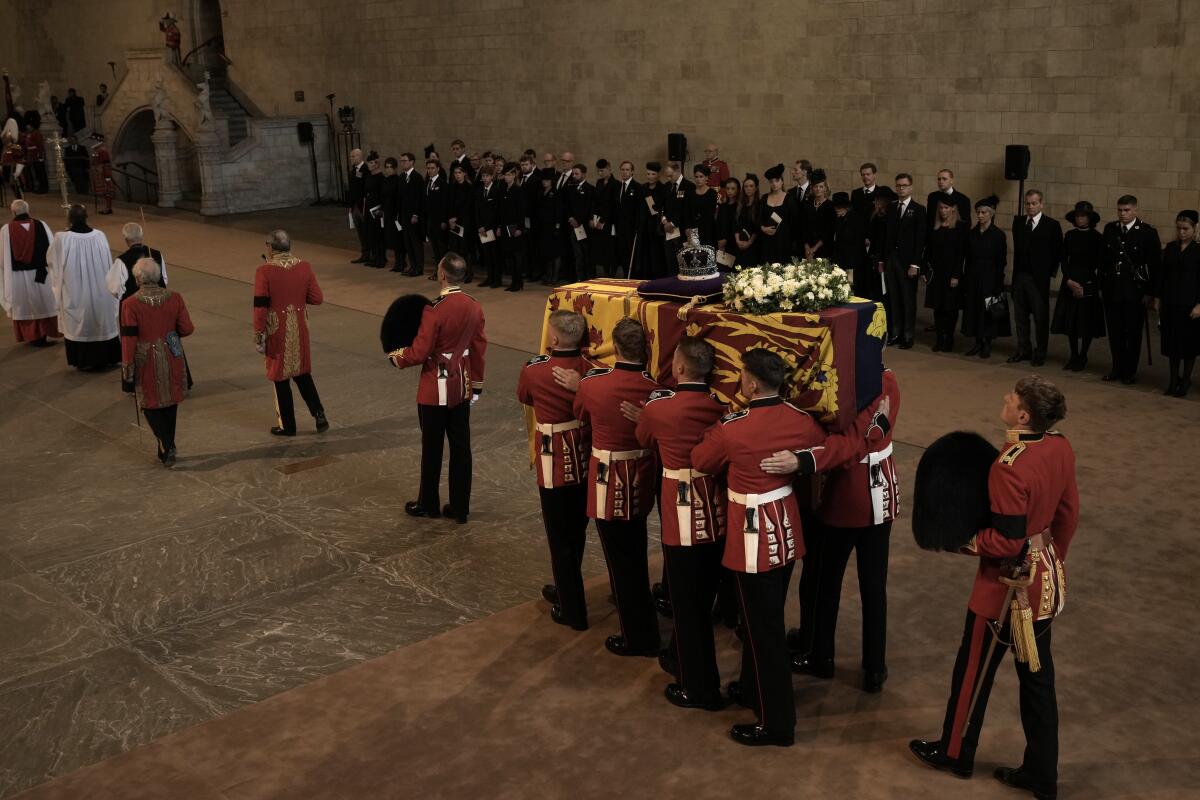 The coffin of Queen Elizabeth II is carried inside Westminster Hall