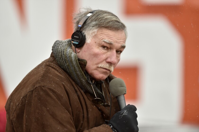 FILE - Former Cleveland Browns lineman and current radio broadcaster Doug Dieken works from the field before an NFL game against the Cincinnati Bengals, Sunday, Dec. 11, 2016, in Cleveland. Doug Dieken, who after retiring as a left tackle for the Browns became a beloved radio color commentator for the team, is retiring from broadcasting after spending 50 years with the organization. Dieken's last game will be Cleveland's season finale on Sunday, Jan. 9, 2022 against Cincinnati.(AP Photo/David Richard, File)