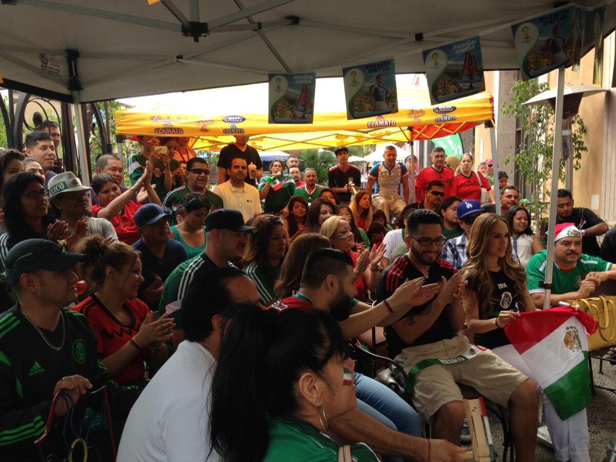 Soccer fans gather in Plaza Mexico in Lynwood on Sunday morning to watch the World Cup match between Mexico and the Netherlands.