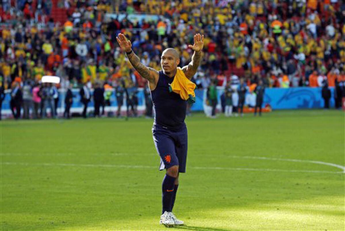 Nigel de Jong greets spectators after the group B World Cup soccer match between Australia and the Netherlands on June 18, 2014.