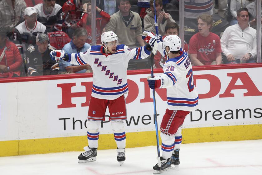New York Rangers left wing Artemi Panarin celebrates with left wing Chris Kreider after scoring a goal during the third period in Game 4 of an NHL hockey Stanley Cup first-round playoff series against the Washington Capitals, Sunday, April 28, 2024, in Washington. (AP Photo/Tom Brenner)