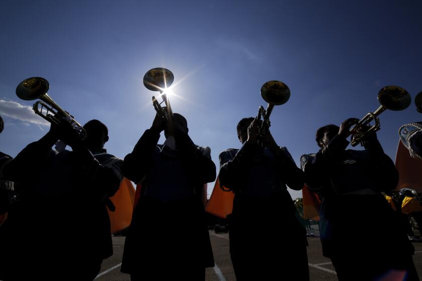 File - The Southern University Human Jukebox marching band warms up before the 2023 National Battle of the Bands at NRG Stadium, Saturday, Aug. 26, 2023, in Houston. Student loan payments resume in October after a three-year pause due to the pandemic. (AP Photo/Michael Wyke, File)