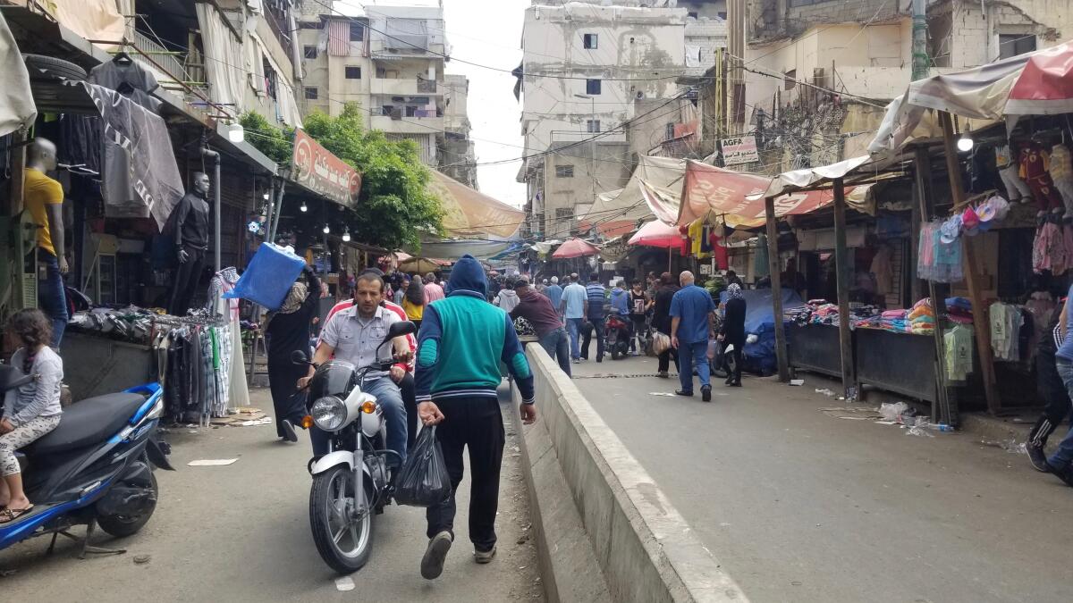 Sabra Street leads into Shatila, a decades-old camp for Palestinian refugees that has turned into a slum.