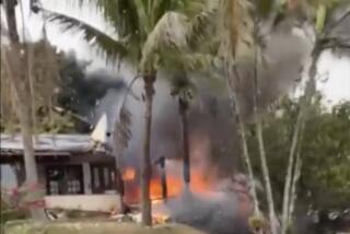 This frame grab from UGC video provided by Felipe Magalhaes Filho shows fire coming from a plane that crashed by a home in Vinhedo, Sao Paulo state, Brazil, Friday, Aug. 9, 2024. (Felipe Magalhaes Filho via AP)