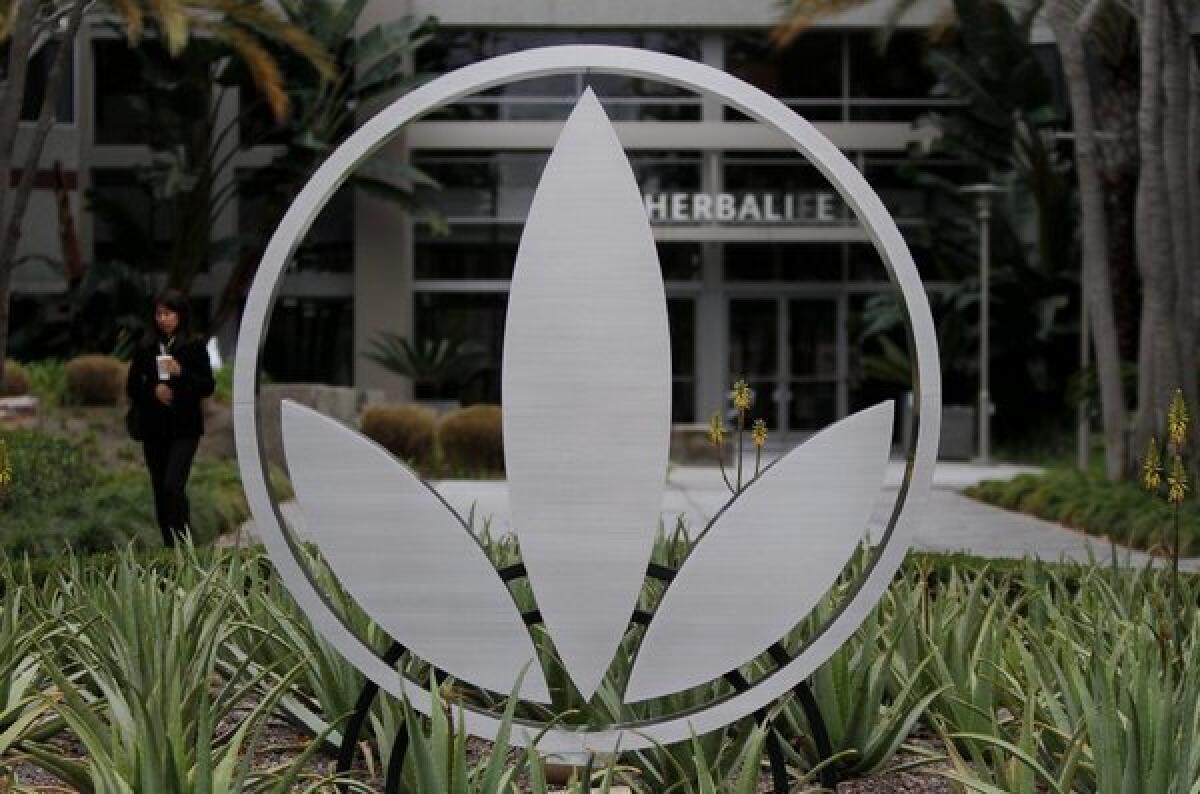 Herbalife denies hedge fund manager's allegations that it is a pyramid scheme.