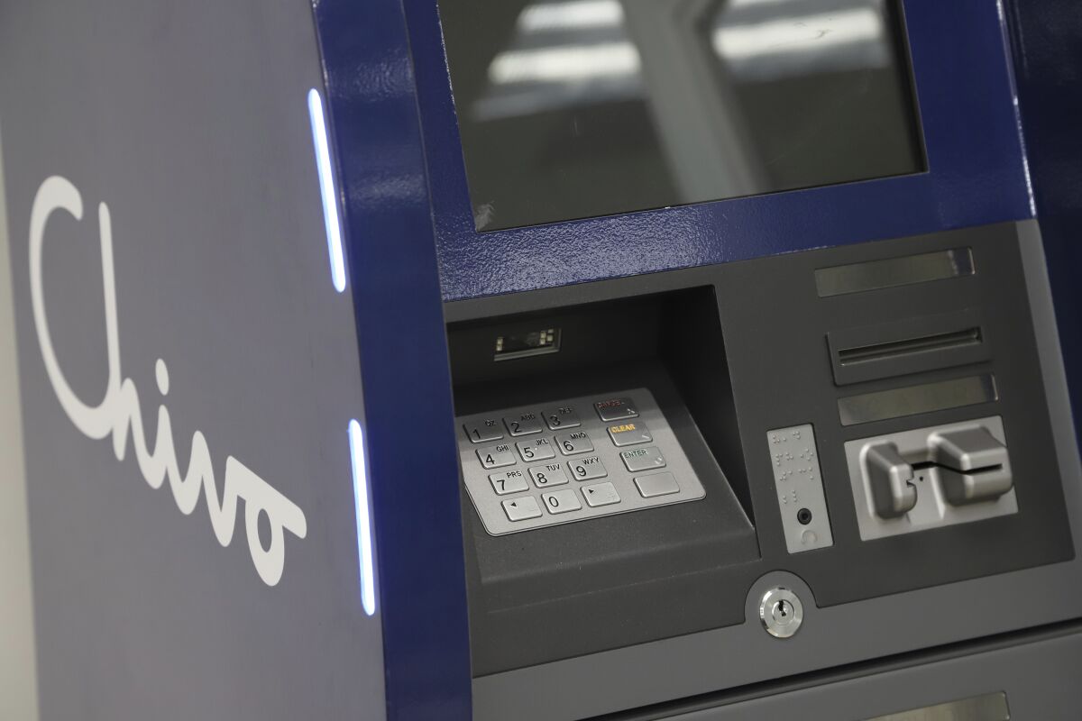A government-run Chivo machine that will soon exchange cash for dispense Bitcoin cryptocurrency stands in a booth of the state-owned Banco Hipotecario, in San Salvador, El Salvador, Wednesday, Sept. 1, 2021. Starting Tuesday, Sept. 7, all businesses will have to accept payments in Bitcoin, except those lacking the technology to do so. (AP Photo/Salvador Melendez)