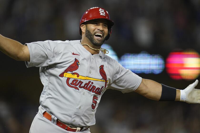 St. Louis Cardinals designated hitter Albert Pujols (5) reacts after hitting a home run during the fourth inning.