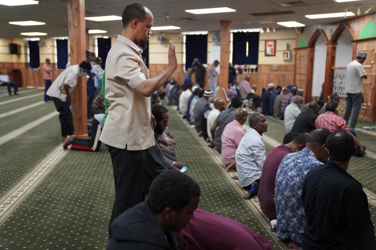 A man prays with fellow Muslims in Minneapolis.