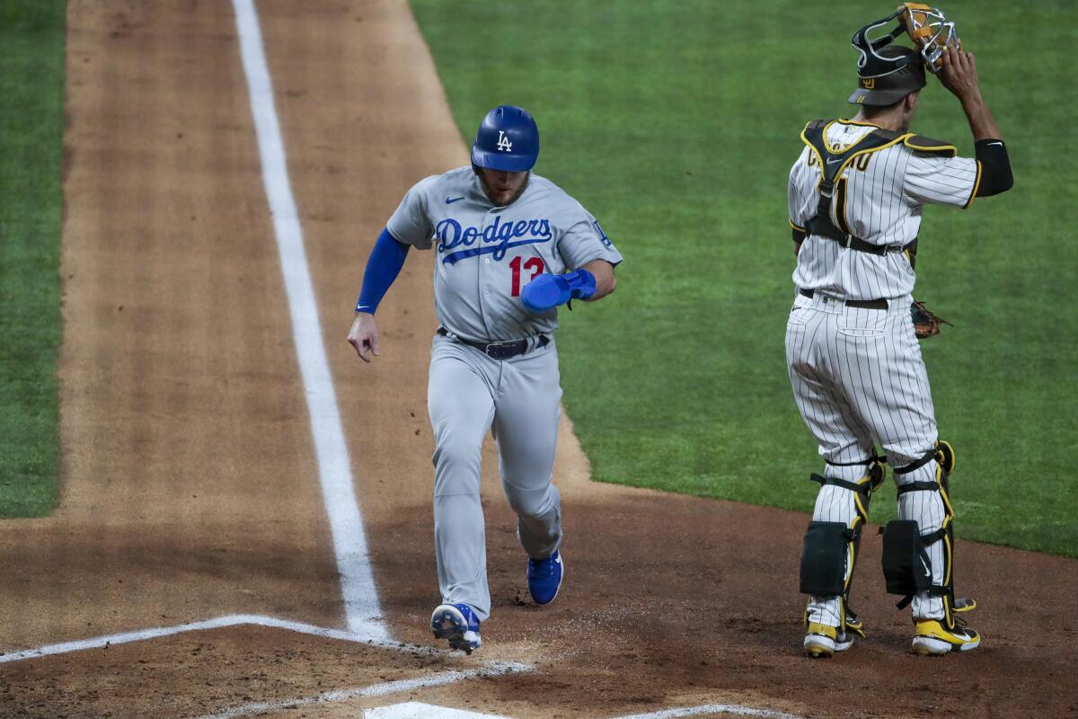 Dodgers first baseman Max Muncy scores during the second inning in Game 2.