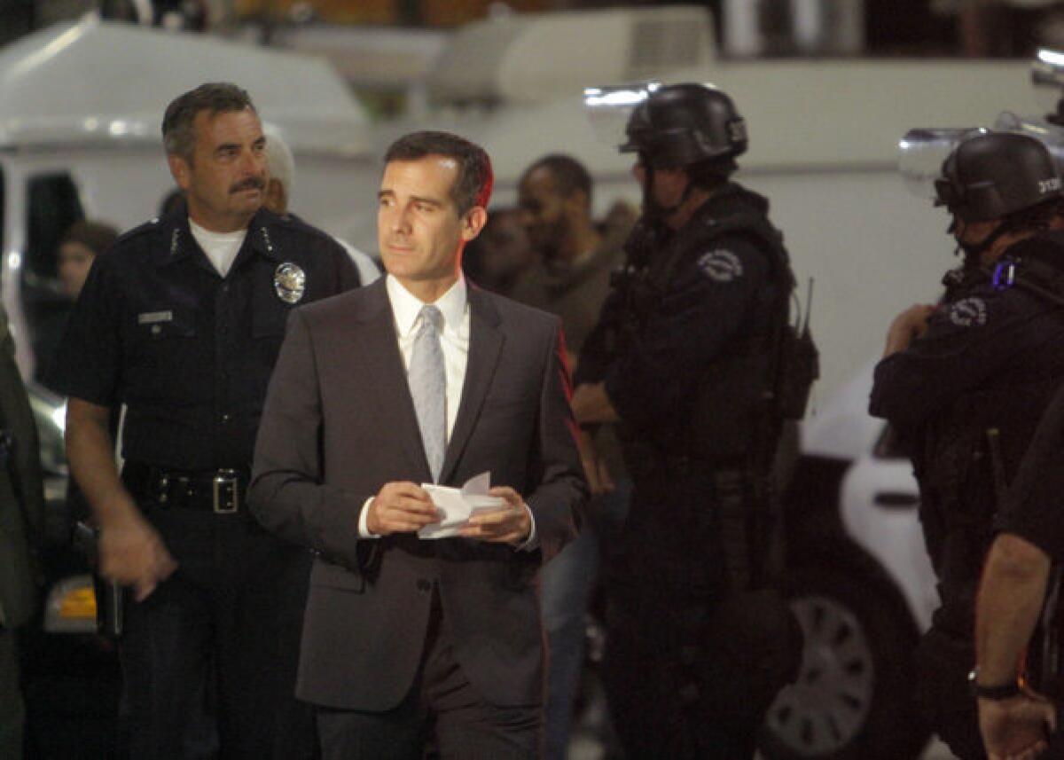 Mayor Eric Garcetti, shown here in July with LAPD Chief Charlie Beck, announced on Wednesday four new appointments to the Police Commission, which oversees the LAPD.