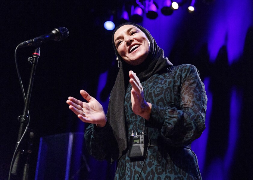 Today's Sinead O'Connor, converted to Islam and wearing a head scarf as she performs. 