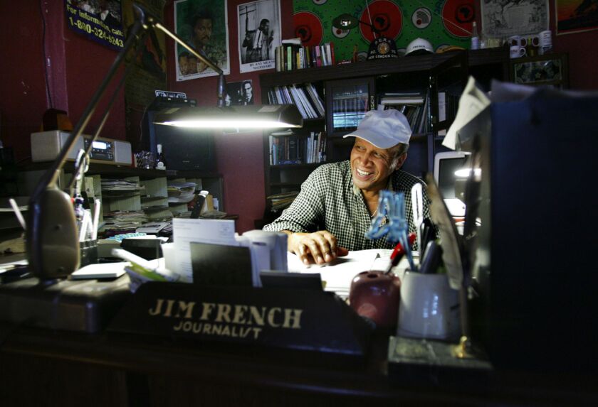 James "Jim" French smiles in his office in 2005 in Charleston, S.C. French, the founder of a weekly paper that has served as a mainstay for Black communities in Charleston, South Carolina, for nearly half a century, has died. He was 94. French, who founded The Charleston Chronicle in 1971, died July 31, 2021, The Post and Courier reported. (Alan Hawes/The Post And Courier via AP)