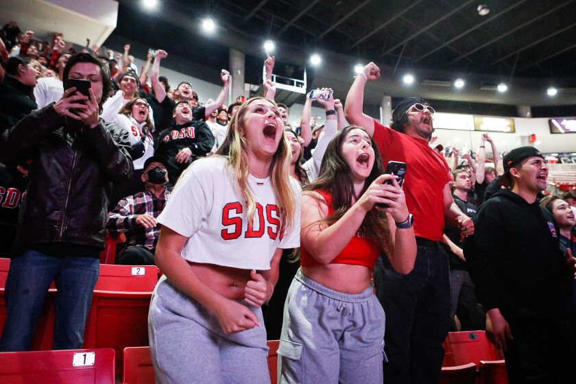 San Diego, CA - March 24: Stephanie Davis and Eden Molay celebrate after the Aztecs' beat Alabama during their Sweet 16 matchup in the NCAA Tournament at a watch party inside Viejas Arena on Friday, March 24, 2023 in San Diego, CA. (Meg McLaughlin / The San Diego Union-Tribune)