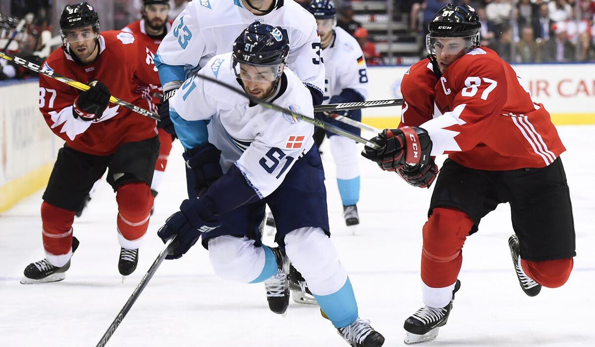 Canada's Sidney Crosby (87) chases Europe's Frans Nielsen (51) during the third period of Game 1 of the World Cup of Hockey final on Tuesday.