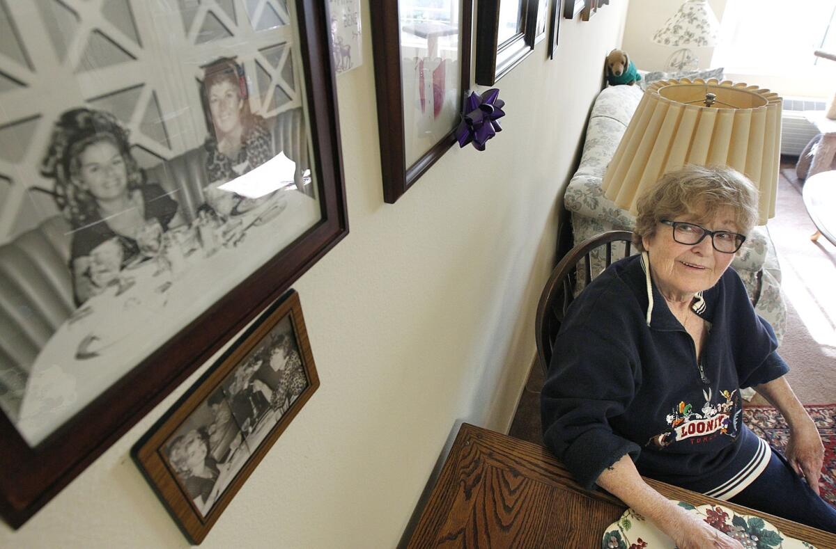 Alice Herman, 78, sits at the dining table of her Hollywood apartment at Triangle Square, the only senior living complex that caters to LGBT people in Los Angeles. Herman couldn't access her late partner's benefits and was planning to move into her car before getting an apartment at Triangle Square.