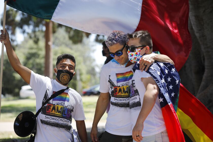 Oscar Rendon, left, Adrian Ramirez, and Sebastian Dunne organized the Love & Equality, Gay Pride Protest which went from Hillcrest to Balboa Park. The rally against police brutality and racism was organized by the Family of San Diego City College - the school's LGBTQ student organization on July 19, 2020.
