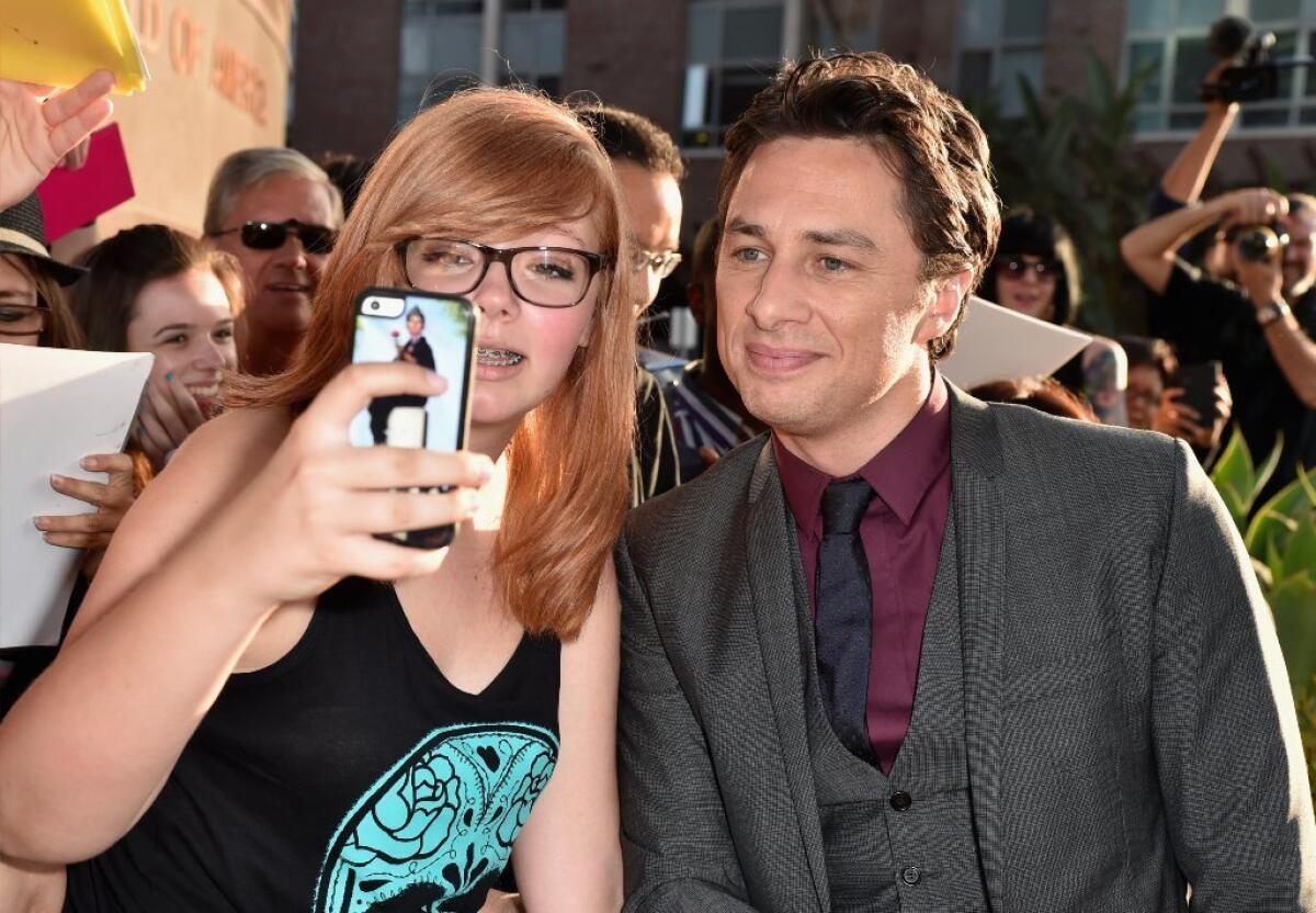 Zach Braff takes a selfie with a "Wish I Was Here" fan outside the Directors Guild of America in Los Angeles.