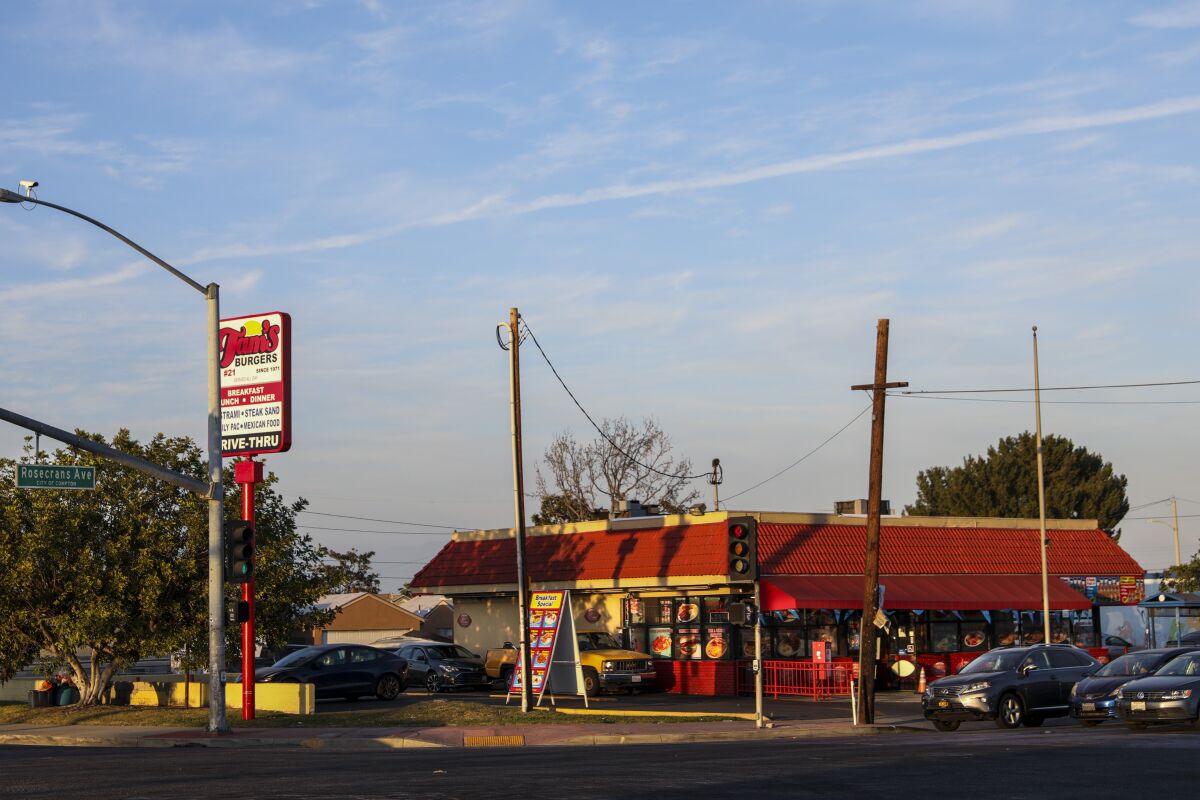 The sun sets on Tam's Burgers #21 on Rosecrans Avenue in Compton