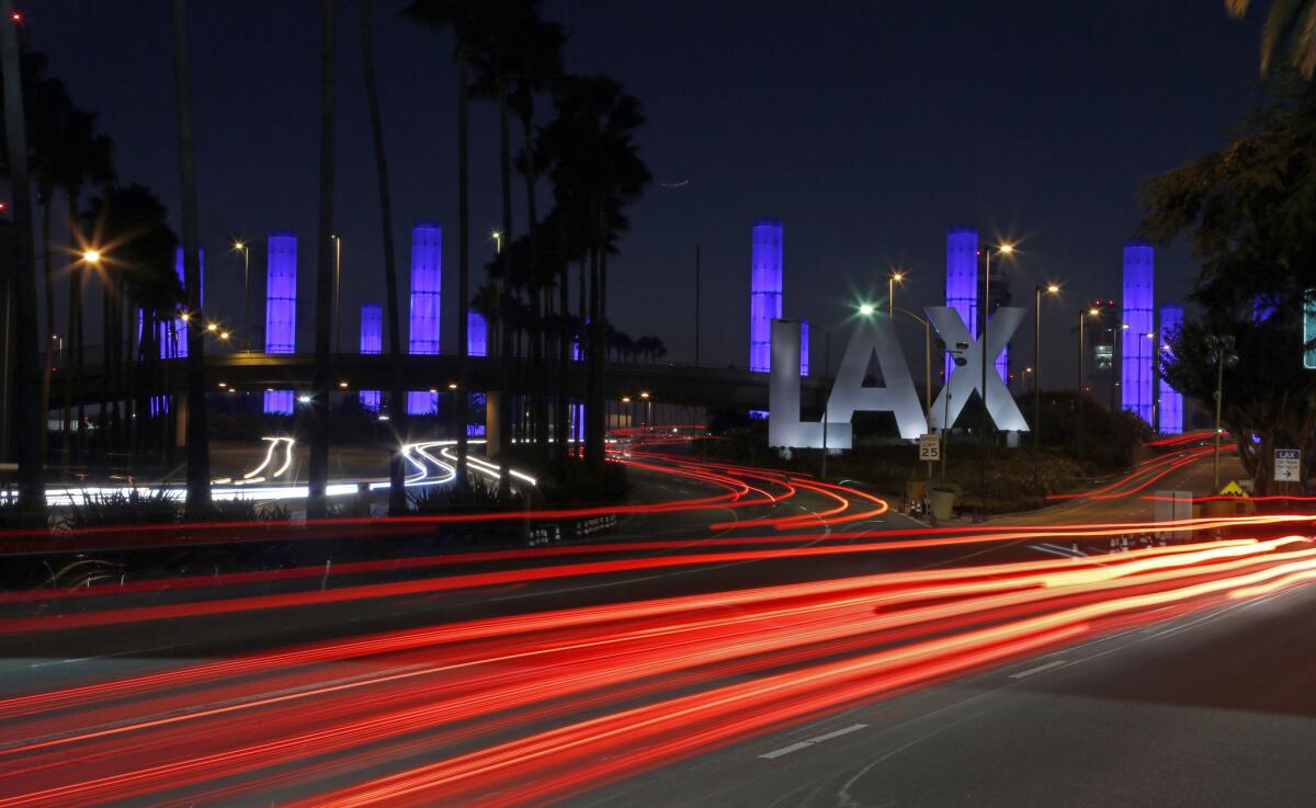 The lighted pylons at the Century Boulevard entrance to Los Angeles International Airport.