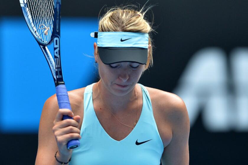 Third-ranked Maria Sharapova reacts during her fourth-round loss to 24th-ranked Dominika Cibulkova at the Australian Open on Monday.