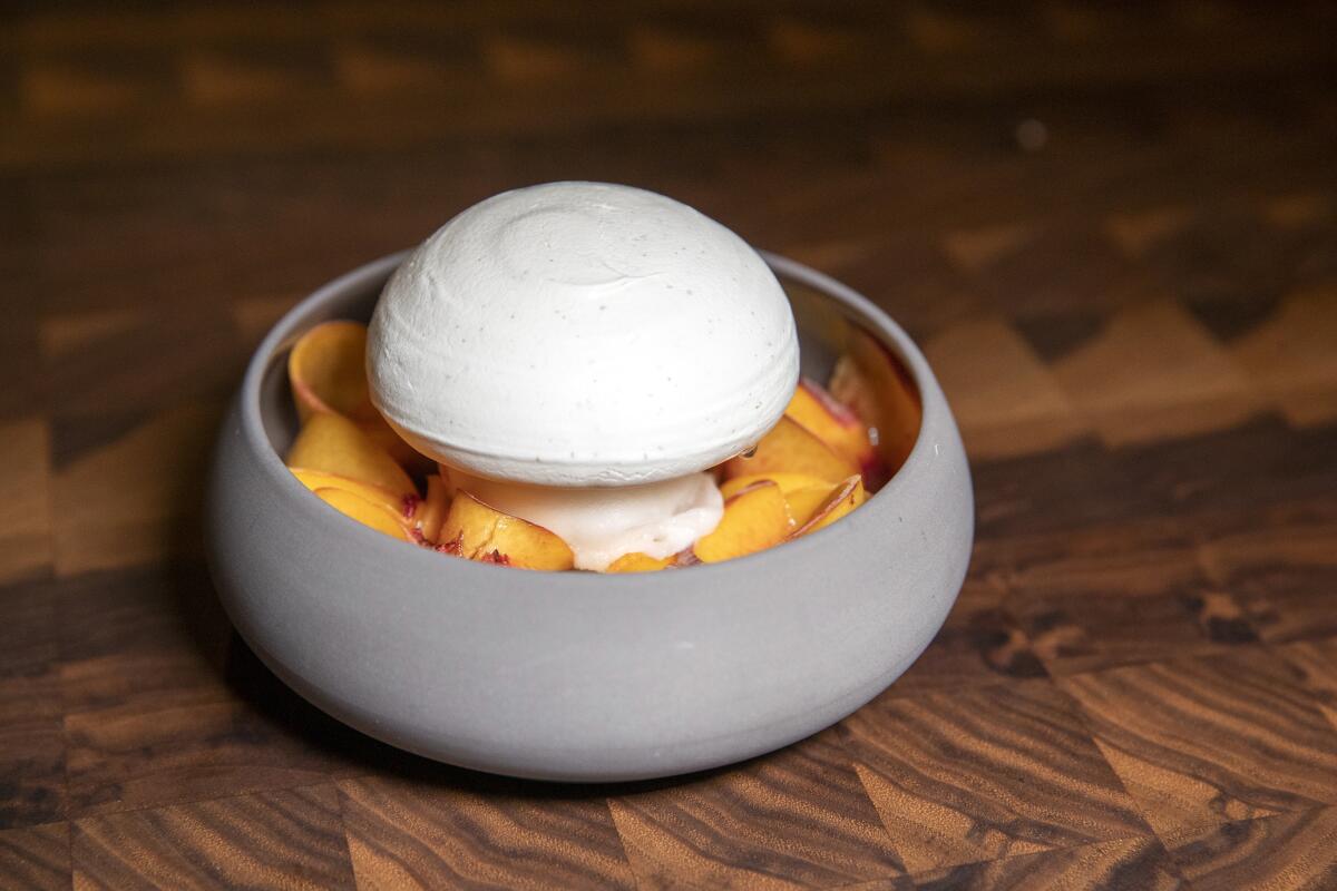 Peach pavlova, one of Lincoln Carson’s standout desserts at Bon Temps.