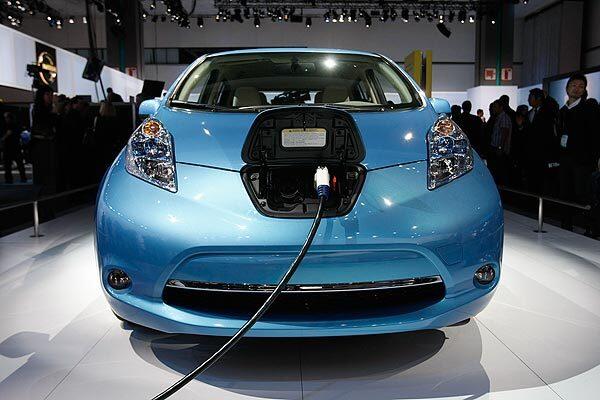 A Nissan Leaf ready for a charge is shown at the 2010 L.A. Auto Show. See full story