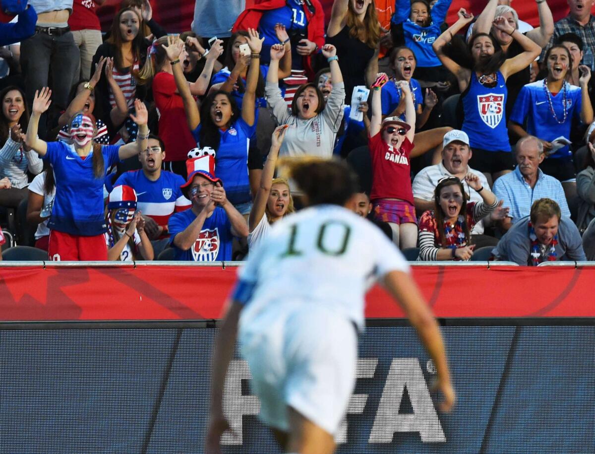American fans celebrate after midfielder Carli Lloyd (10) scored against China in the Women's World Cup quarterfinal last year. The large television audience for the team's victorious run prompted ESPN to pick up the rights to televise 14 matches of the National Women’s Soccer League.