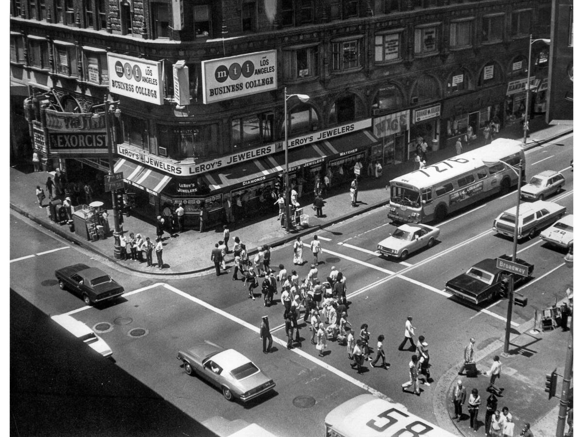 July 9, 1974: Pedestrians around noon at intersection of 7th and Broadway.