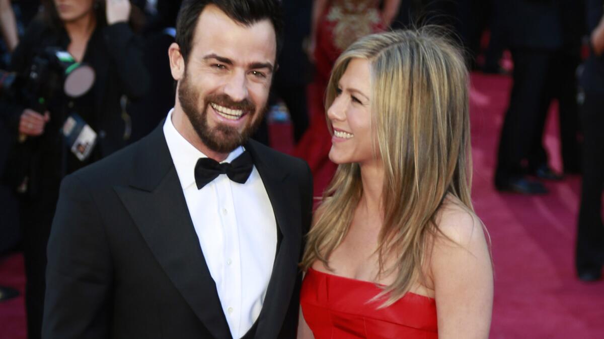 Here's a peek at the front of the red Valentino dress that Jennifer Aniston wore to the Oscars in 2013. Justin Theroux posted a filtered, full back view of his wife in the gown on Instagram for Woman Crush Wednesday.