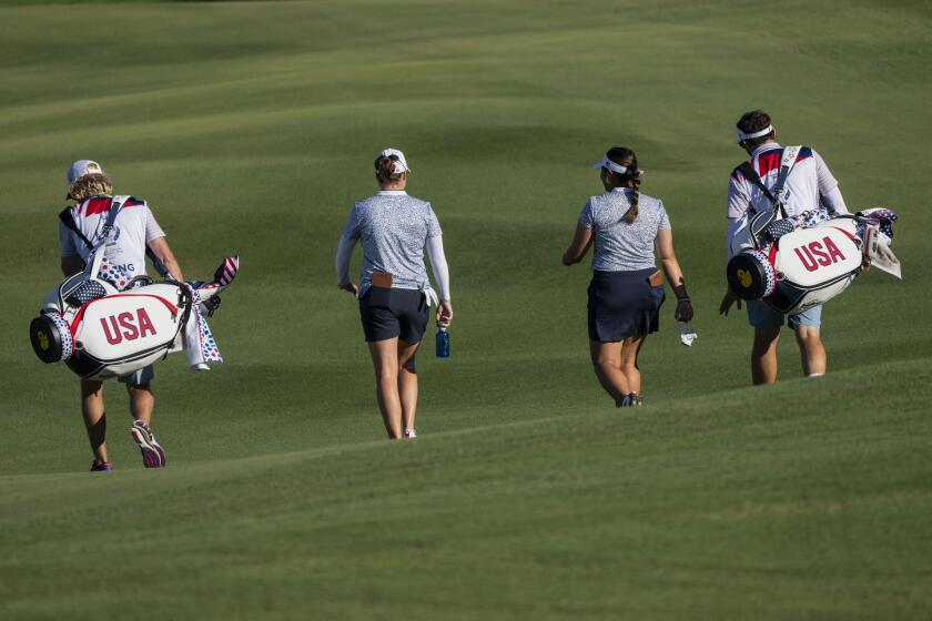 Solheim Cup team US golfers Ally Ewing, second left, and Lilia Vu, second right, walk during a training session at Finca Cortesin, near Estepona, southern Spain, on Wednesday, Sept. 20, 2023. (AP Photo/Bernat Armangue)