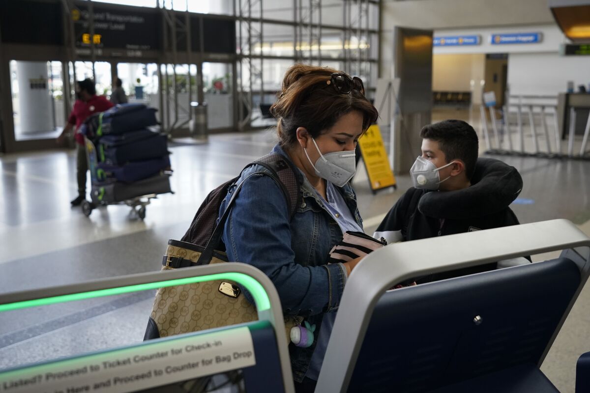 Esmeralda Elizalde checks in for her flight to Mexico at LAX on Monday.