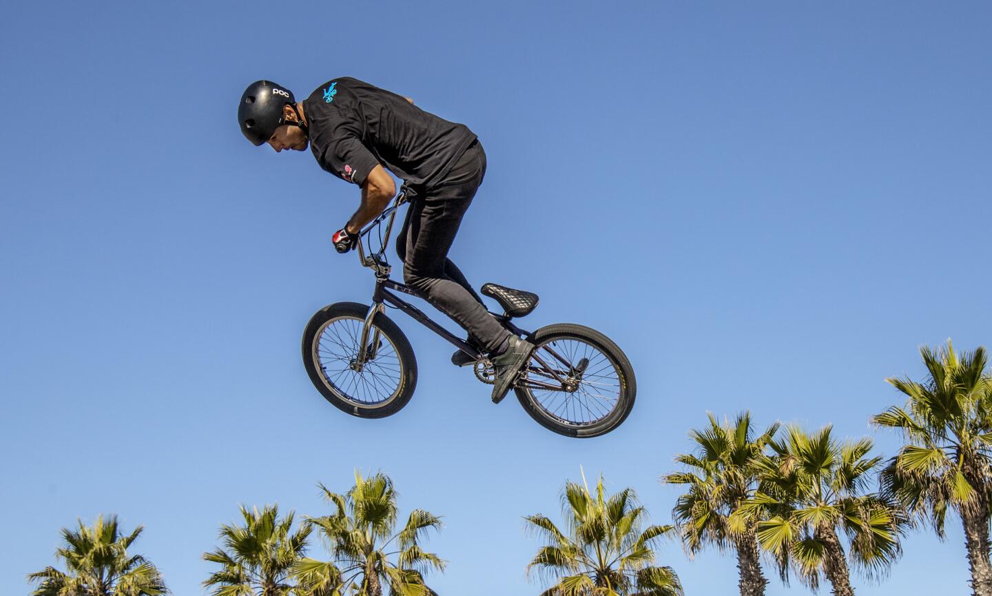 BMX Freestyle Team bicyclist Victor Salazar flies over Huntington Beach. (Photo by Spencer Grant)