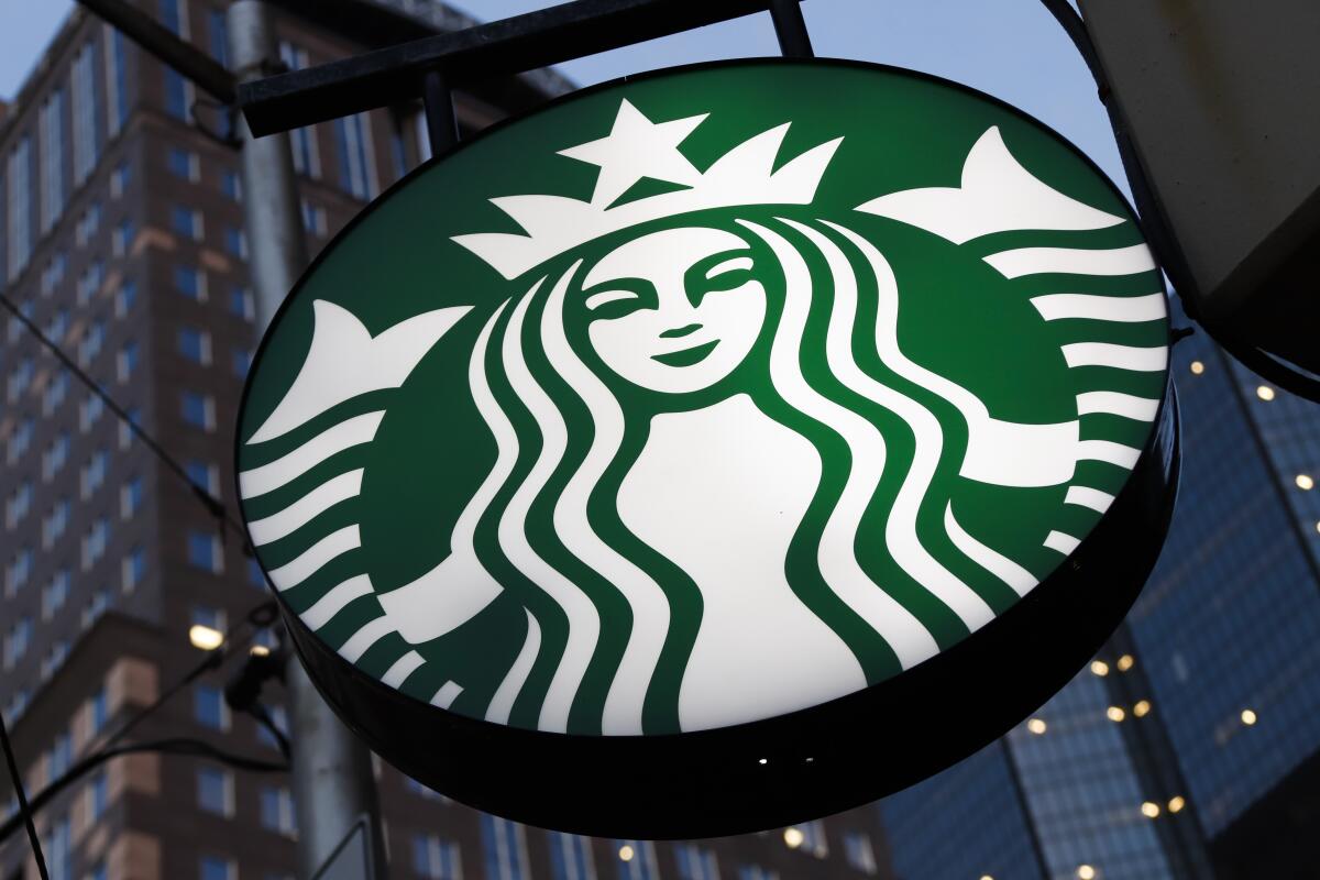 FILE - This file photo taken on June 26, 2019, shows a Starbucks sign outside a Starbucks coffee shop in downtown Pittsburgh, Pa. Starbucks is closing 16 stores around the country because of repeated safety issues, including drug use and other disruptive behaviors that threaten staff. The coffee giant said Tuesday, July 12, 2022, the closures are part of a larger effort to respond to staff concerns and make sure stores are safe and welcoming. (AP Photo/Gene J. Puskar, File)