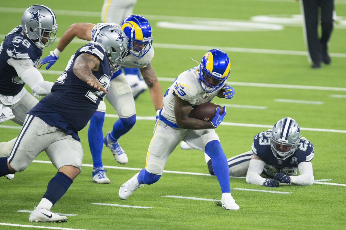 Rams running back Cam Akers carries the ball against the Cowboys on Sept. 13, 2020.