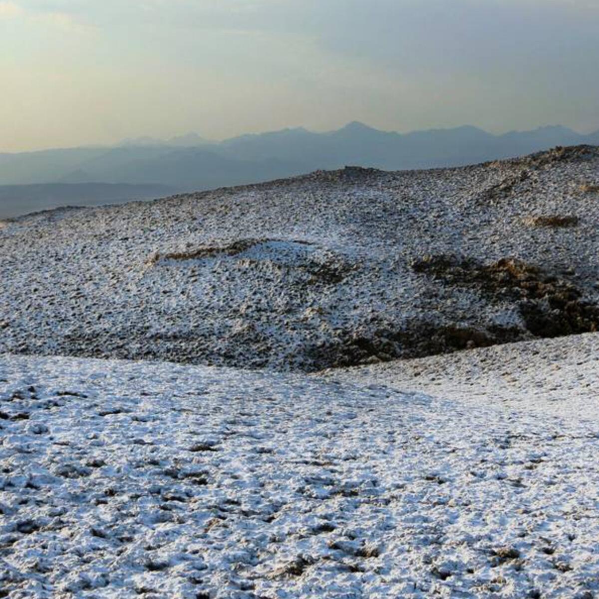 Dissolved salt and minerals resemble snow on the ground.