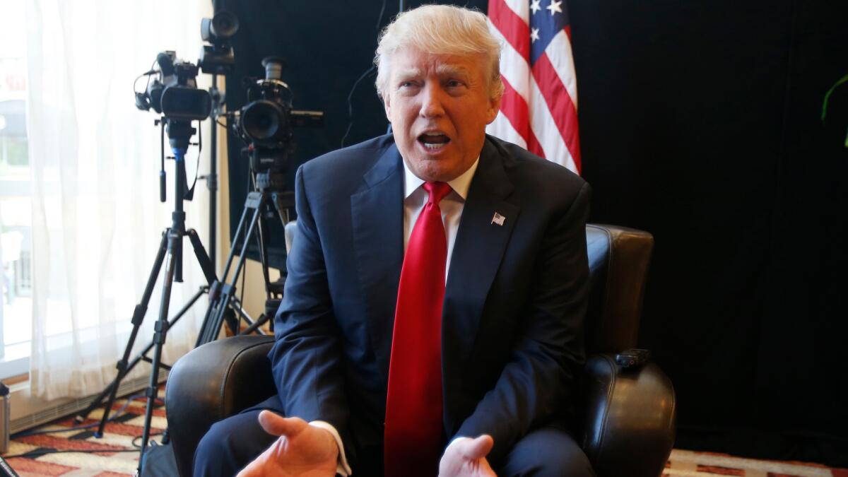 Republican Presidential candidate Donald Trump gestures during an interview after a rally in Virginia Beach, Va. on July 11.