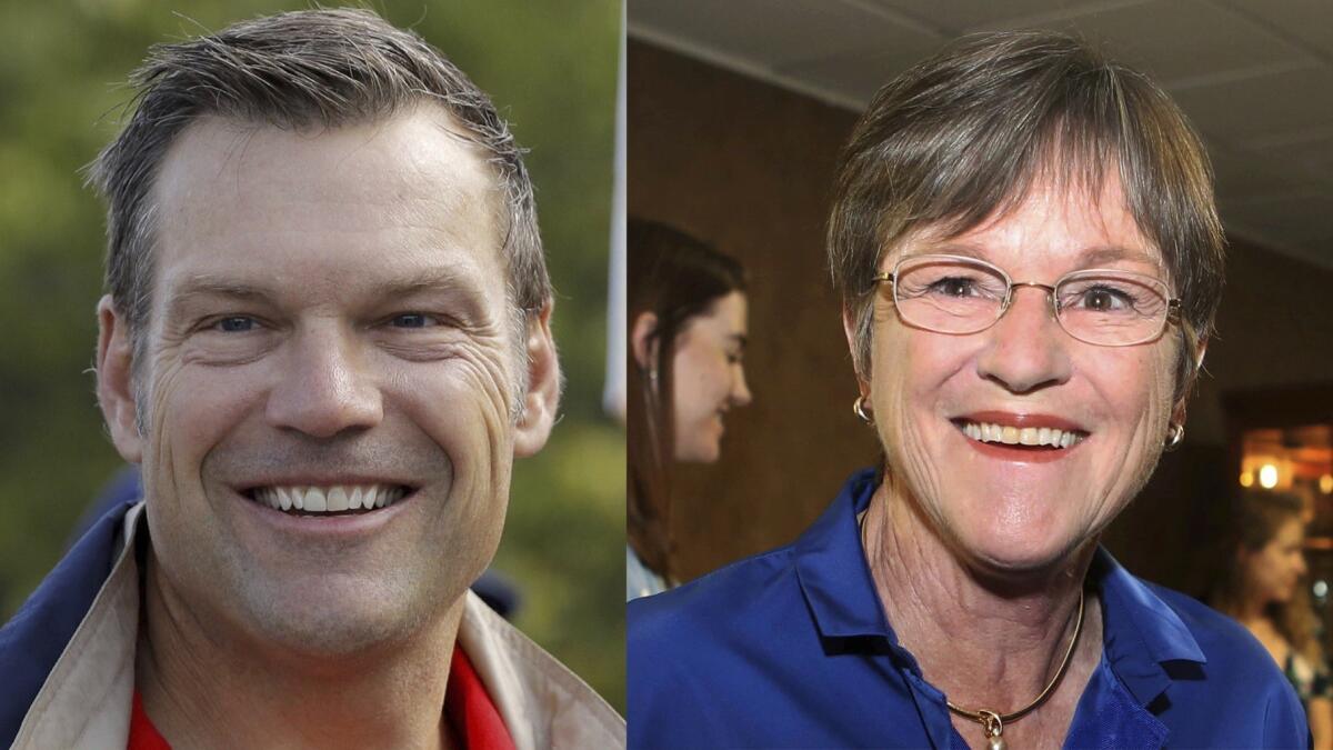 Kansas Secretary of State Kris Kobach and Kansas state Sen. Laura Kelly, D-Topeka