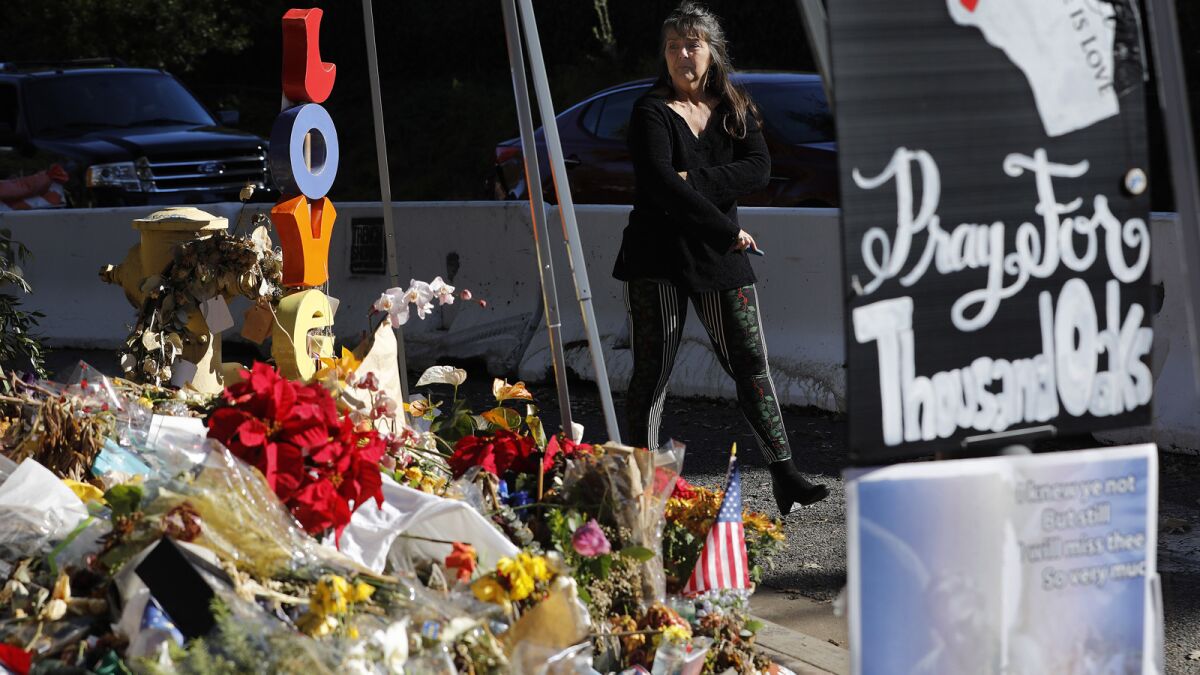 Cindy Parent of Camarillo visits a memorial for victims of the mass shooting at the Borderline Bar and Grill.