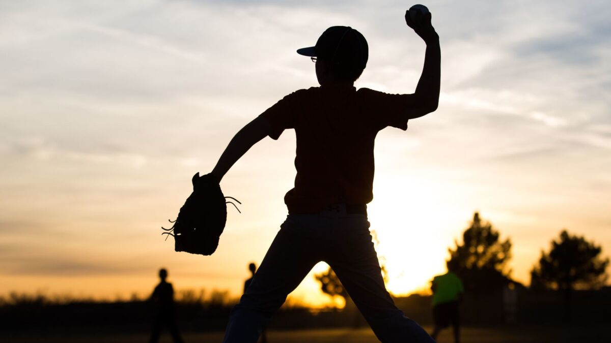 Kaiden Wells, 10, throws a baseball at a practice in Odessa, Texas, in 2015.